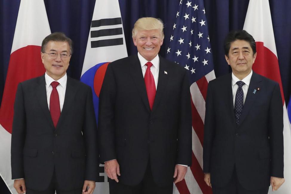 UPI South Korean President Moon Jae-in (L), U.S. President Donald Trump and Japanese Prime Minister Shinzo Abe